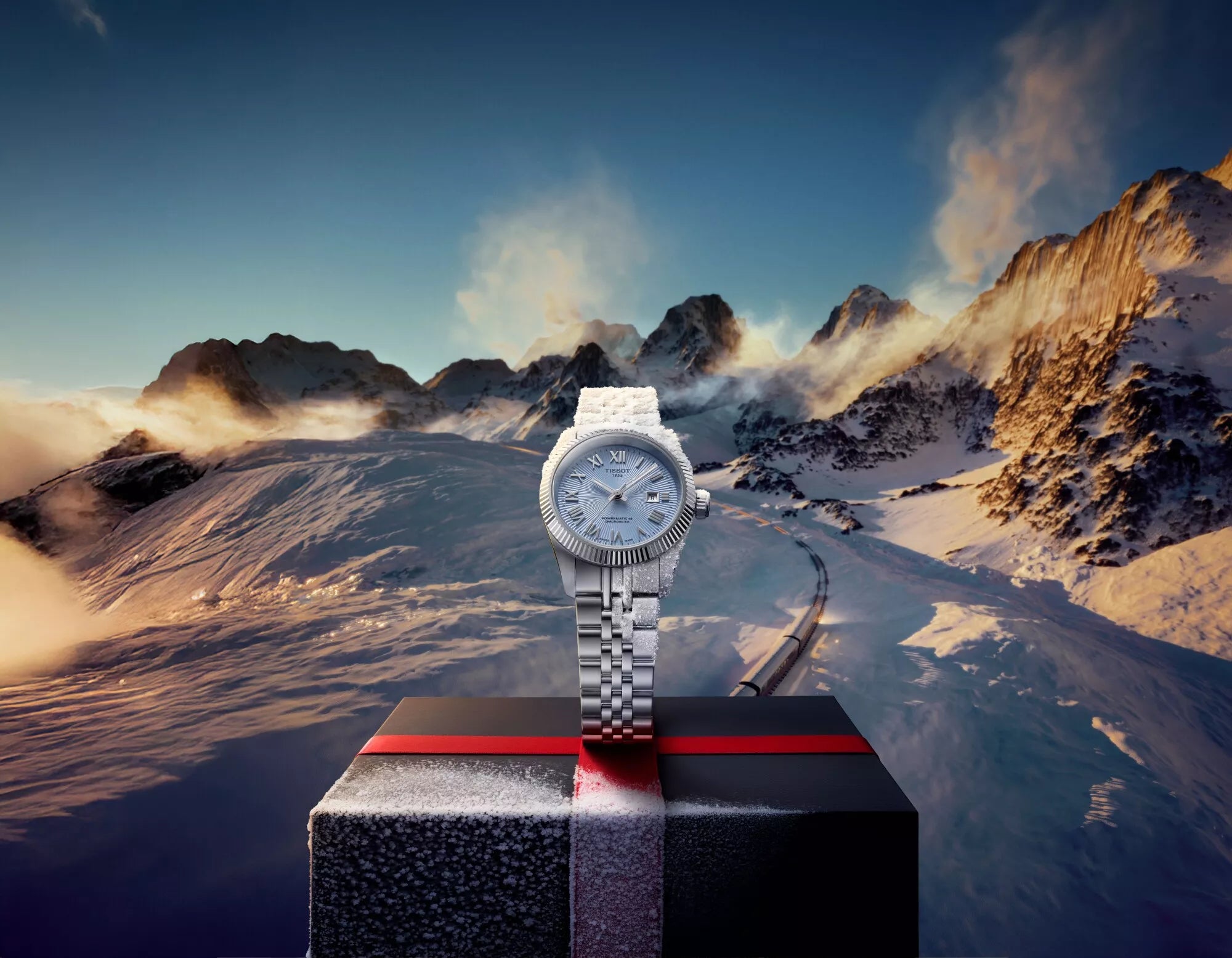 Watch on a stand with a mountainous landscape in the background